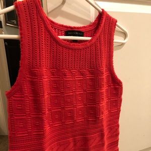 Sleeveless red sweater